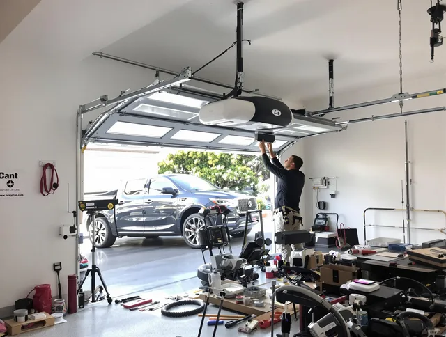 Cromwell Garage Door Repair specialist installing smart garage door opener system in Cromwell home